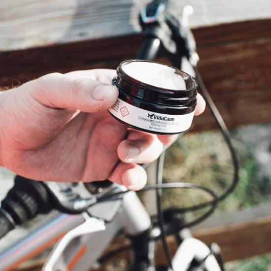 A cyclist has a jar of medicinal cream made from cannabis